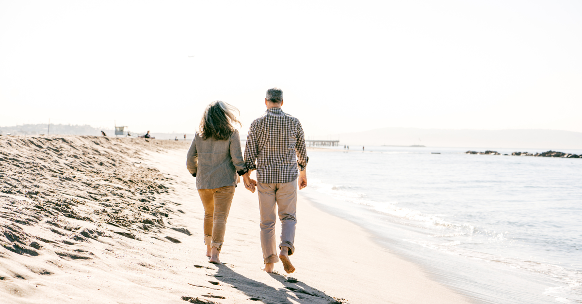 Walking on the beach with knee issues.